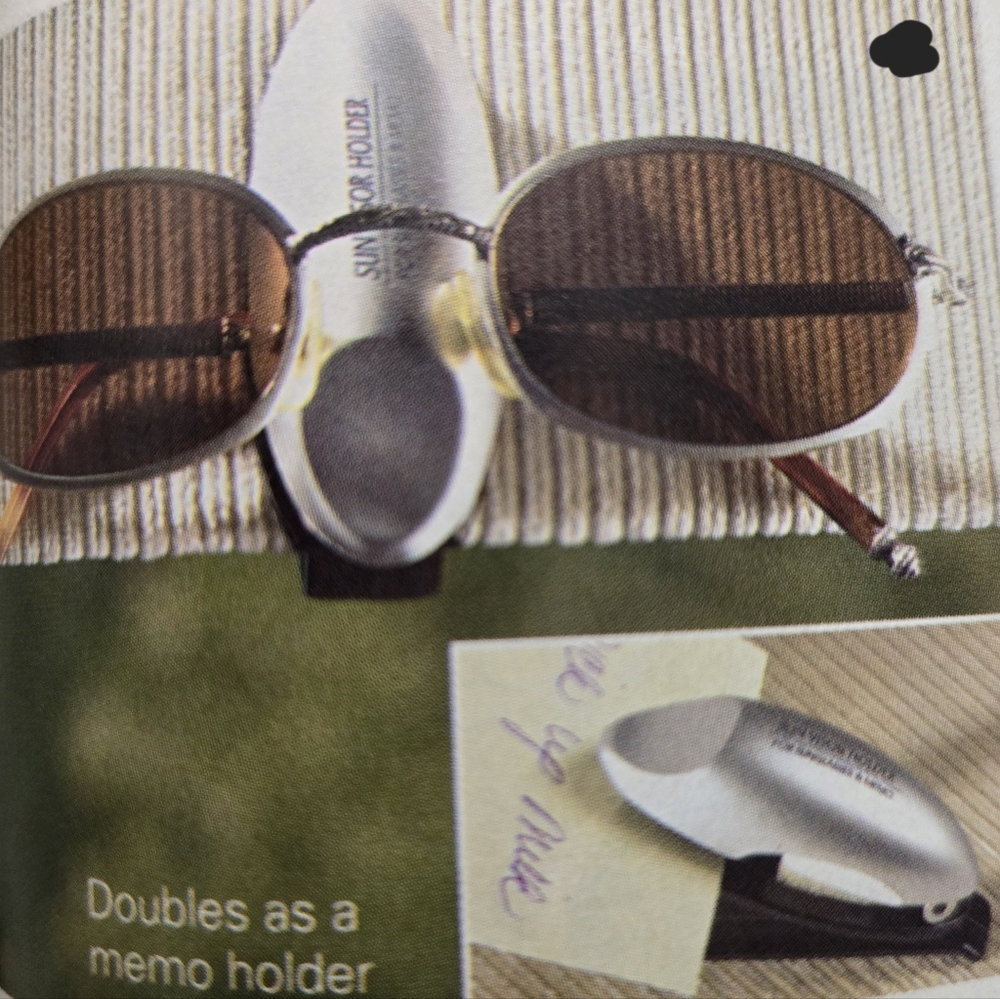 Automotive sunglass/and memo holder 1" x 3" high color:silver and black.